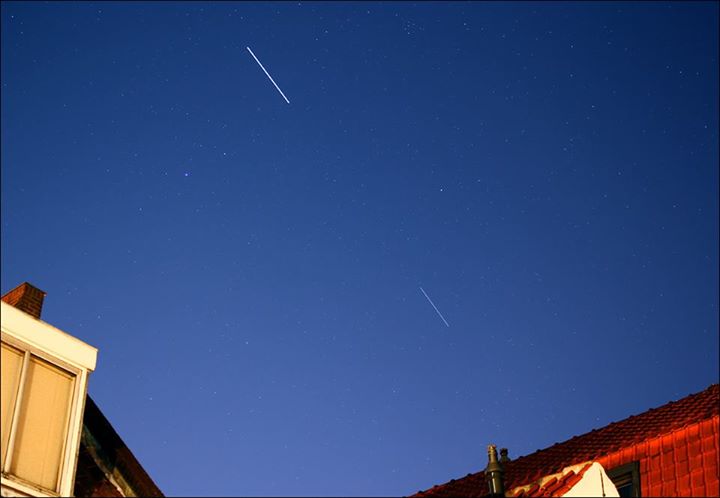 The International Space Station (thick streak) seen with the SpaceX Dragon CRS-9…