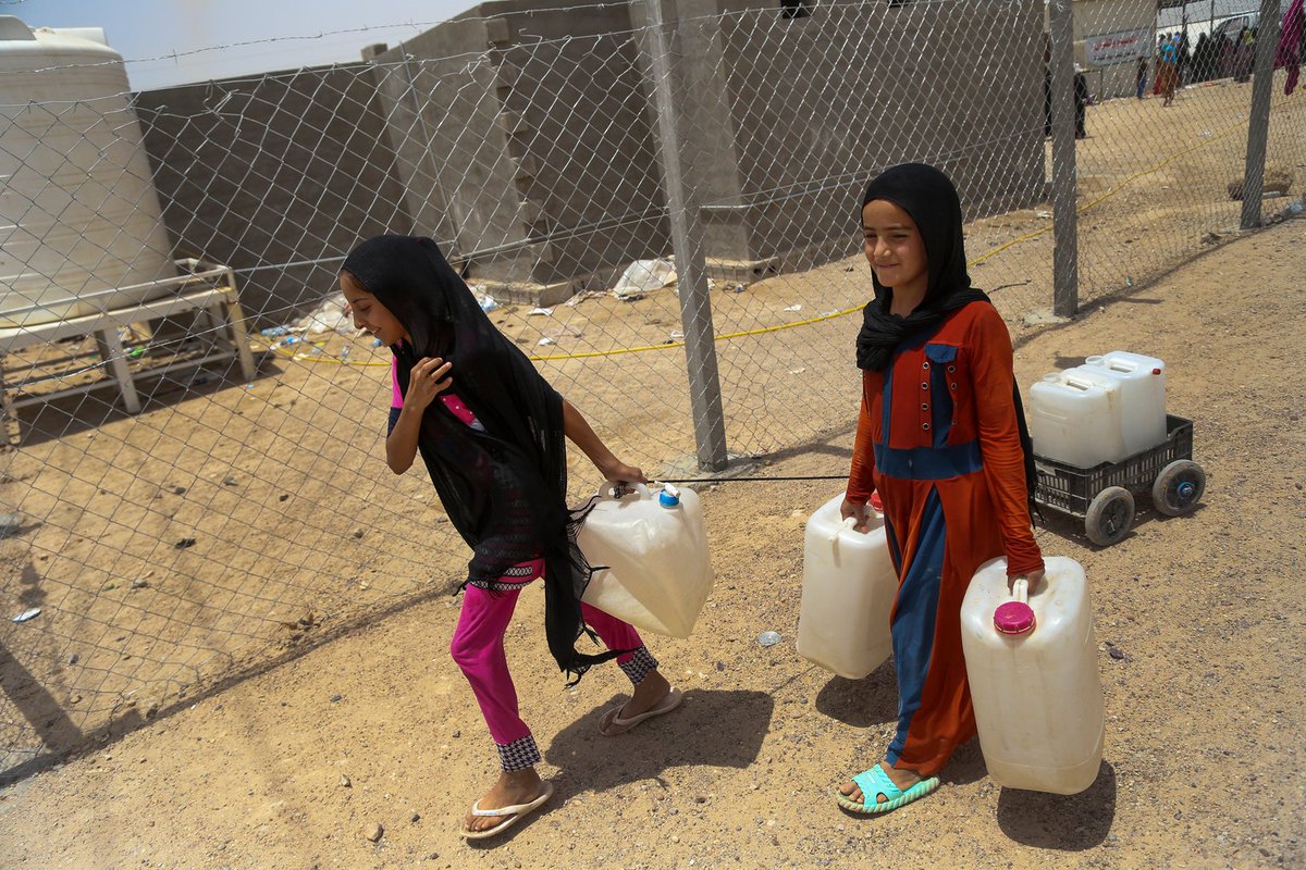 Young girls recently displaced from Fallujah, #Iraq on their way to collect wate…