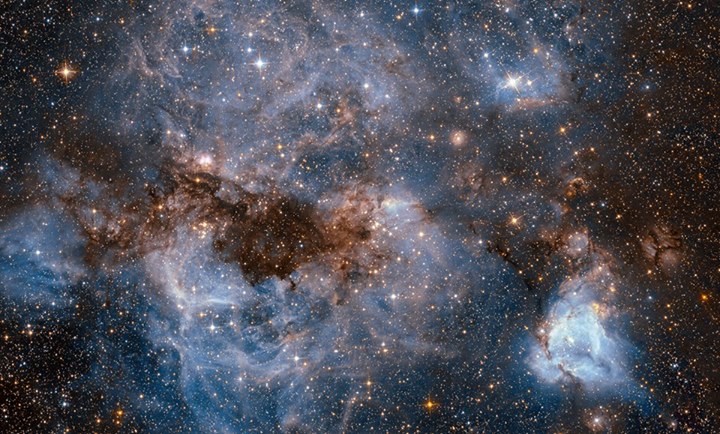 This stormy scene shows a stellar nursery that contains many…
