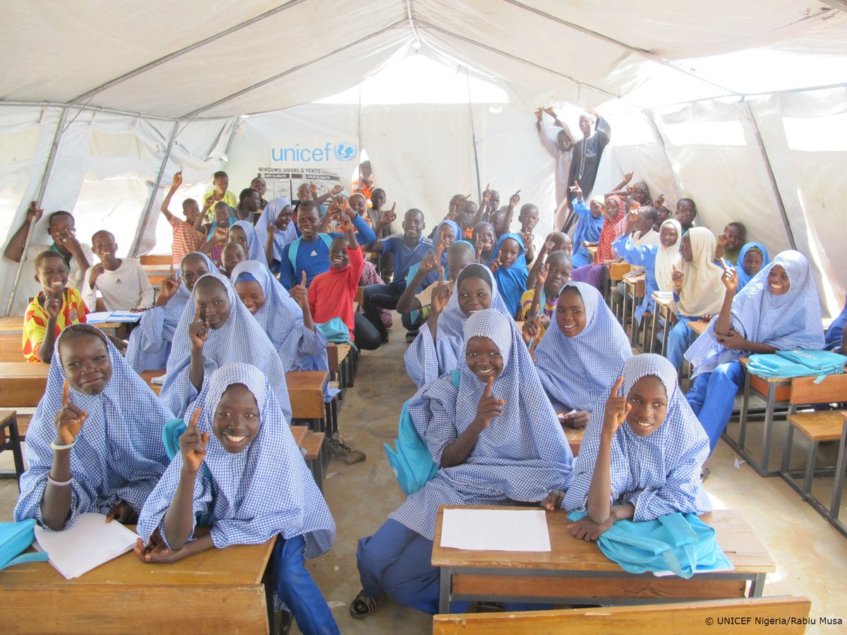 These children are all smiles at a temporary learning space in a displacement ca…