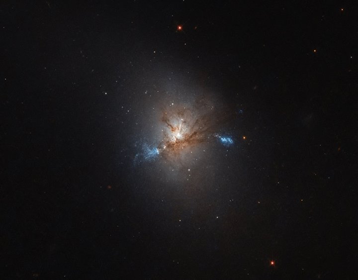 NGC 1222, seen in this image taken by the NASA/ESA Hubble Space Telescope, is a …