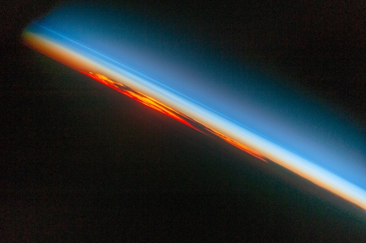A fiery sunset seen by an astronaut aboard the International…