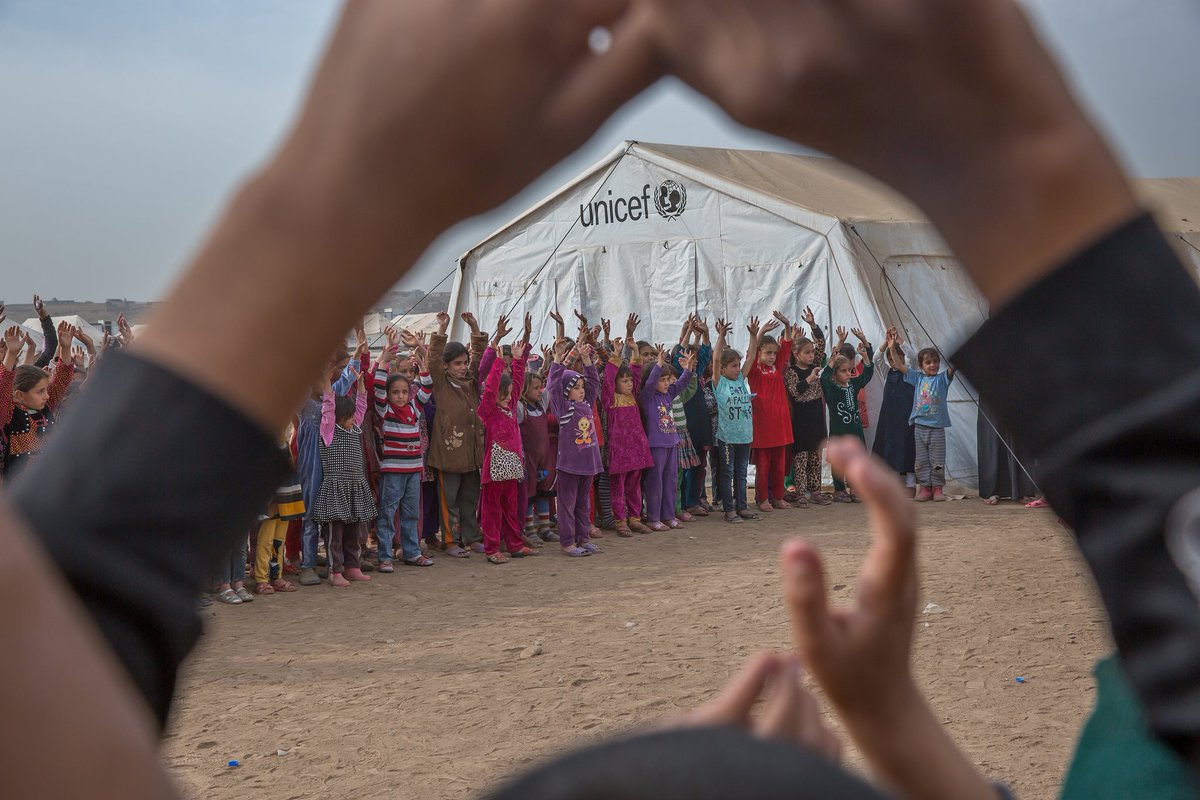Children who fled #Mosul play outside a @UNICEFiraq-supported learning space in …