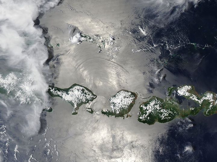 The ocean appears bright silver in this image of Indonesia d…