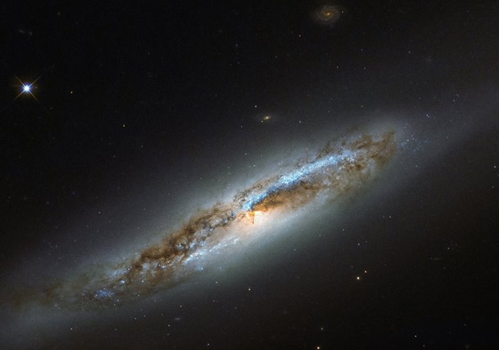 This is NGC 4388, as seen by the NASA/ESA Hubble Space Telescope, one member of …