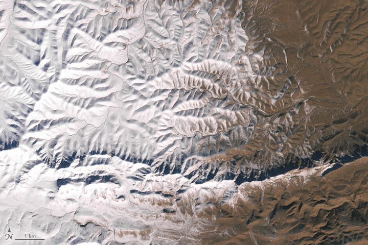 Snow on the edge of the Sahara Desert in Africa is rare, yet…