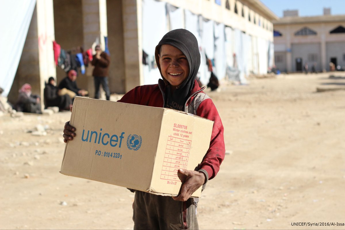 Displaced from eastern #Aleppo, 10-year-old Ahmed receives a box of warm winter …