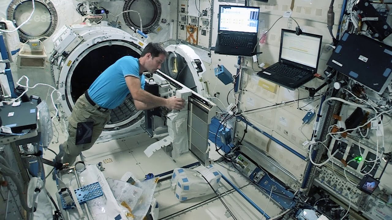ESA astronaut Thomas Pesquet working in the Japanese Kibo laboratory to prepare …