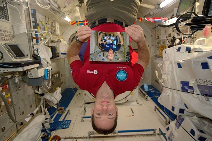 A picture of me on the Space Station holding a picture of Tim Peake, holding a p…