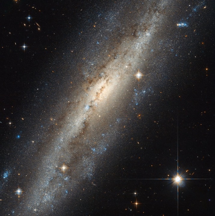 This spiral galaxy shows evidence of some kind of interactio…