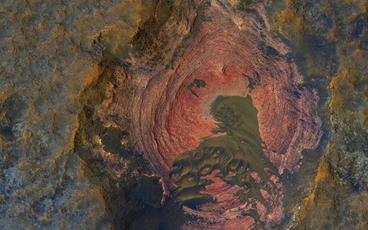 Exposed bedrock on the Martian surface shows reddish layers …