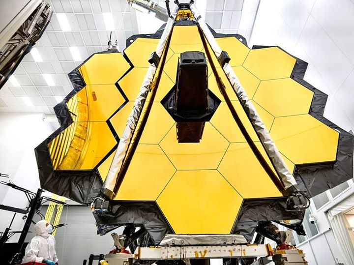 The towering primary mirror of the James  #Webb Space Telescope (JWST) stands in…