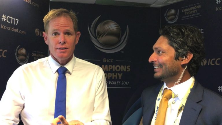 Shaun Pollock gets one back over Kumar Sangakkara