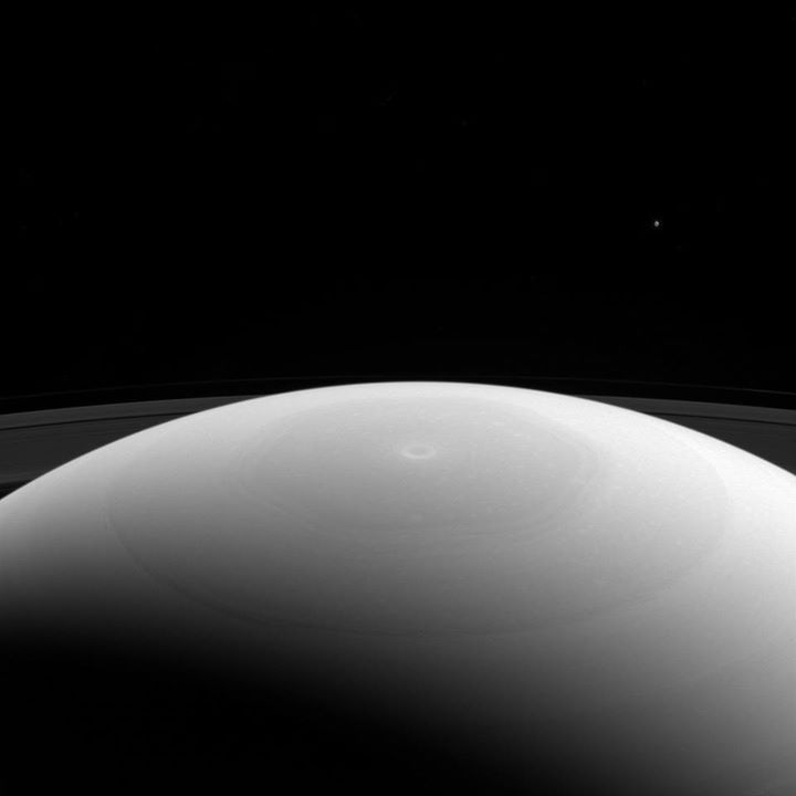 Saturn’s moon Mimas is a mere speck in the upper right, as o…
