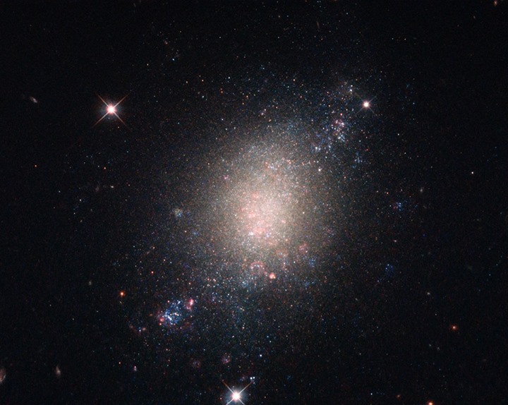 The object in the middle of this image, sitting alone within a star-studded cosm…