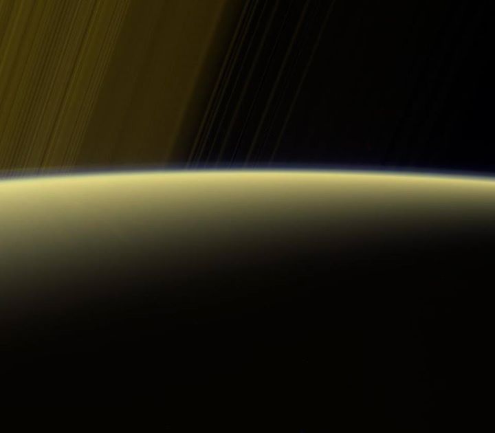 Our Cassini spacecraft gazes toward the rings beyond Saturn’…