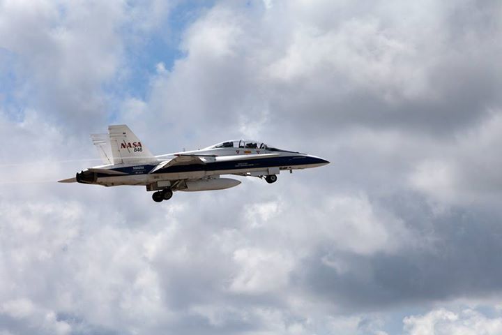 Flying at supersonic speeds, F-18 jets emit sonic booms that…