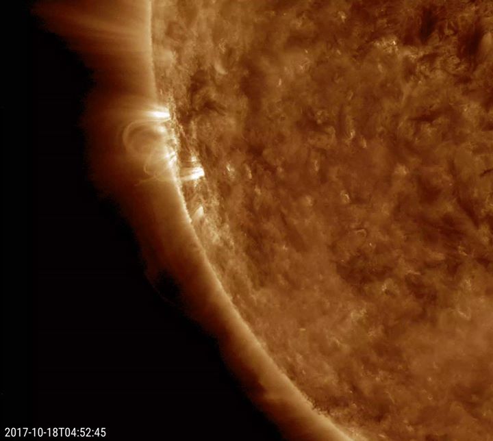 A small eruption on the Sun spewed a bright, disjointed stre…