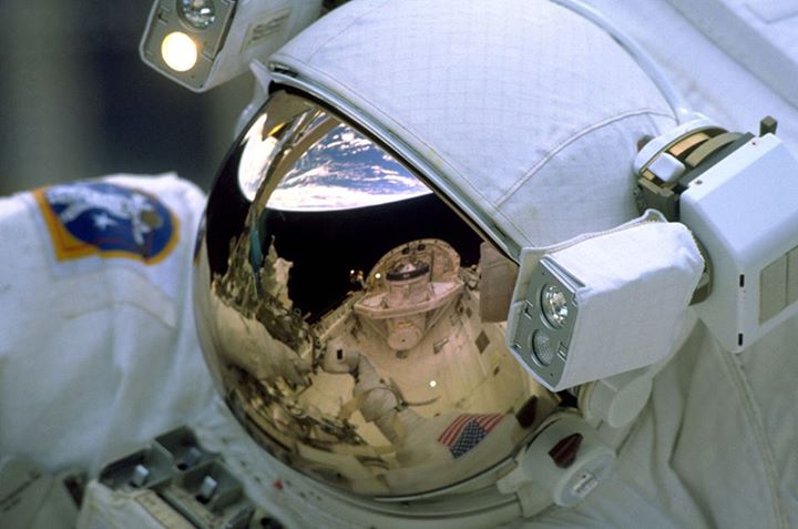 #ThrowbackThursday The Earth reflected in the helmet visor of one of the space w…