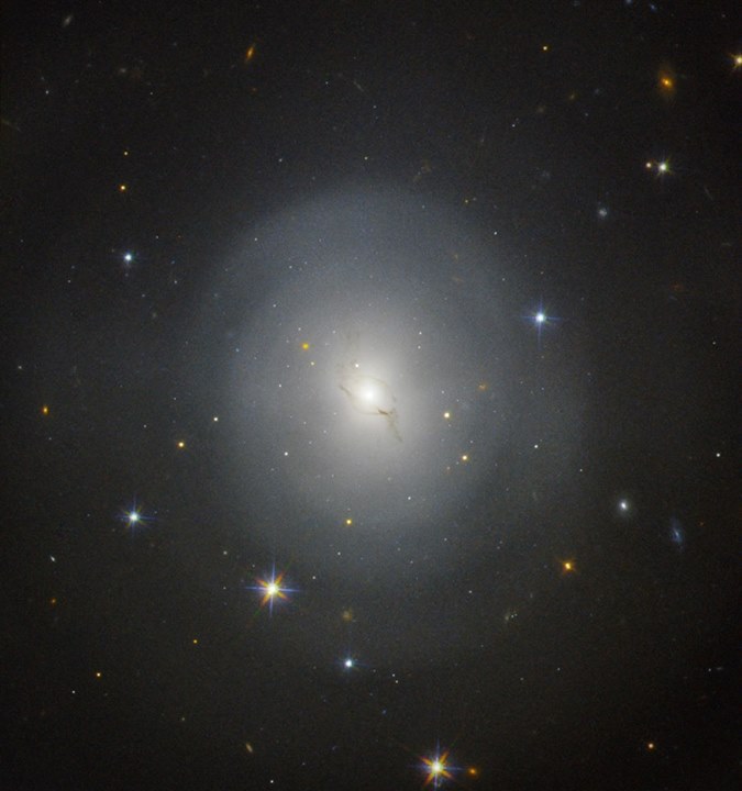 The lenticular galaxy NGC 4993 seen by the NASA/ESA Hubble Space Telescope. On 1…