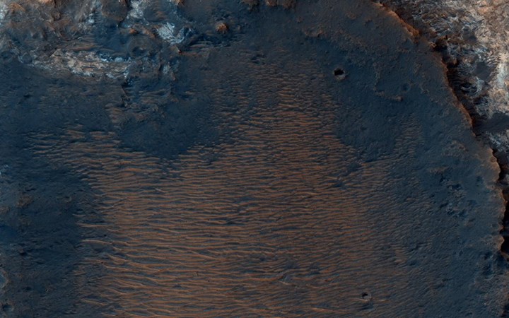 This inverted crater on Mars shows a diversity of exposed be…