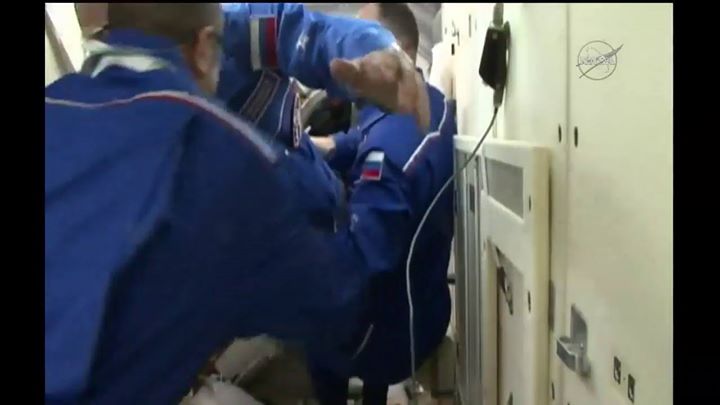 Hatches between the Soyuz spacecraft and the International S…