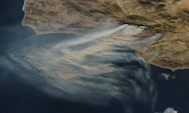 Brown smoke is seen continuing to spew from the Thomas Fire …