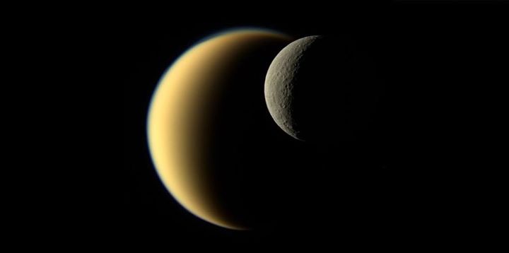 Crescents belonging to two of Saturn’s moons – Rhea and Tita…