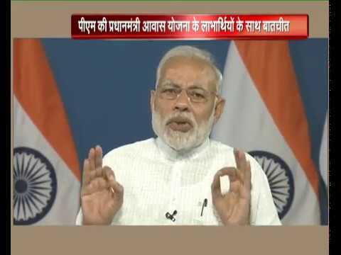 PM Modi interacts with the beneficiaries of Pradhan Mantri Awas Yojana from across India, via VC